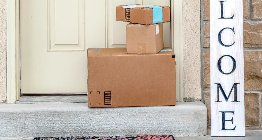 Deliveries on the front porch of a house with a welcome sign in Fresno